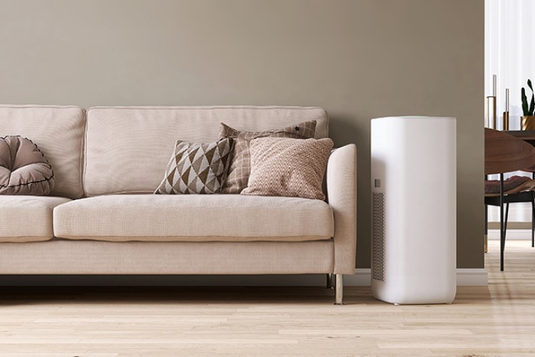 Air purifier next to couch