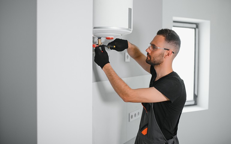 Plumbing inspecting boiler pipes.