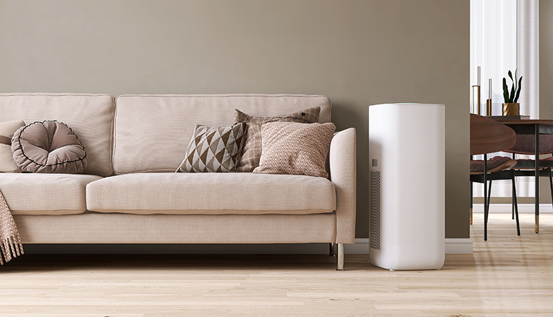 Air purifier next to couch